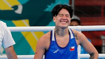 Brazil's Tatiana Regina De Jesus Chagas (L) celebrates after defeating Chile's Denisse Alejandra Arlette Bravo Vilches in the women's 54kg semifinals bout boxing event during the Pan American Games Santiago 2023 at the Olympic Training Centre (CEO) in Santiago on October 26, 2023. (Photo by Javier TORRES / AFP)