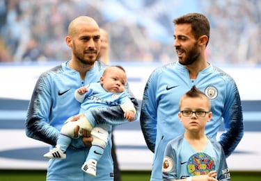 David Silva appears with his son ahead of Manchester City's first home game of the season