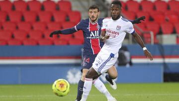 Lyon's Maxwel Cornet, right, and PSG's Alessandro Florenzi watch the ball during the League One soccer match between Paris Saint Germain and Lyon, at the Parc des Princes stadium in Paris, France, Sunday, Dec. 13, 2020. (AP Photo/Thibault Camus)