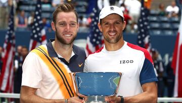 NEW YORK, NY - SEPTEMBER 07: Jack Sock and Mike Bryan of The United States celebrate victory with the winners trophy following the men's doubles final against Lukasz Kubot of Poland and Marcelo Melo of Brazil on Day Twelve of the 2018 US Open at the