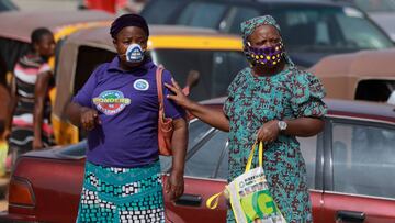 Women wear face masks at Dutse Alhaji market in Abuja, Nigeria. 