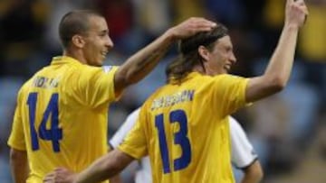 Molis y un compañero de selección.