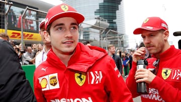 Formula One F1 - Chinese Grand Prix - Shanghai International Circuit, Shanghai, China - April 14, 2019   Ferrari&#039;s Charles Leclerc and Sebastian Vettel before the race   REUTERS/Aly Song