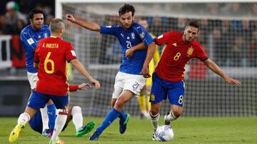 Koke (right) and Andrés Iniesta (second left) tussle with Italy's Marco Parolo (second right) during the sides' 1-1 World Cup qualifying draw this month.