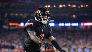 Oct 21, 2024; Glendale, Arizona, USA; Arizona Cardinals wide receiver Greg Dortch (4) celebrates after catching a touchdown pass against the Los Angeles Chargers in the first half at State Farm Stadium. Mandatory Credit: Mark J. Rebilas-Imagn Images