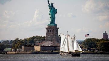 FILE PHOTO: A sailboat passes by the Statue of Liberty in New York Harbor, in New York City, U.S., September 20, 2024. REUTERS/Brendan McDermid/File Photo