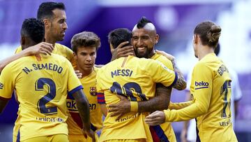 VALLADOLID, SPAIN - JULY 11: Arturo Vidal of FC Barcelona celebrates after scoring his team's first goal with his teammate Lionel Messi during the Liga match between Real Valladolid CF and FC Barcelona at Jose Zorrilla on July 11, 2020 in Valladolid, Spain. Football Stadiums around Europe remain empty due to the Coronavirus Pandemic as Government social distancing laws prohibit fans inside venues resulting in all fixtures being played behind closed doors. (Photo by Mateo Villalba/Quality Sport Images/Getty Images)