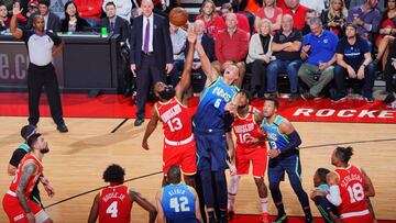 HOUSTON, TX - JANUARY 31: James Harden #13 of the Houston Rockets and Kristaps Porzingis #6 of the Dallas Mavericks go up for a jump ball during the game on January 31, 2020 at the Toyota Center in Houston, Texas. NOTE TO USER: User expressly acknowledges and agrees that, by downloading and or using this photograph, User is consenting to the terms and conditions of the Getty Images License Agreement. Mandatory Copyright Notice: Copyright 2020 NBAE (Photo by Cato Cataldo/NBAE via Getty Images)
