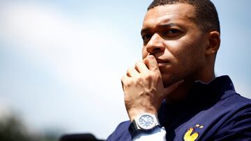 French soccer player Kylian Mbappe listens to French President Emmanuel Macron as he arrives for a lunch at their training camp ahead of the UEFA Euro 2024, in Clairefontaine-en-Yvelines, France, June 3, 2024. REUTERS/Sarah Meyssonnier/Pool