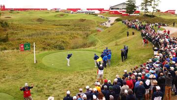 Tommy Fleetwood of England and team Europe plays his shot from the 10th tee as fans look on prior to the 43rd Ryder Cup at Whistling Straits on September 21, 2021, in Kohler, Wisconsin.