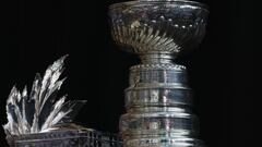 The Conn Smythe Trophy and the Stanley Cup are on display during the 2022 NHL Stanley Cup Final Media Day