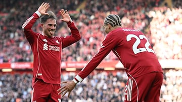 Liverpool's Argentinian midfielder #10 Alexis Mac Allister celebrates with Liverpool's French striker #22 Hugo Ekitike after scoring their third goal during the English Premier League football match between Liverpool and West Ham United at Anfield in Liverpool, north west England on February 28, 2026. (Photo by Paul ELLIS / AFP) / RESTRICTED TO EDITORIAL USE. No use with unauthorized audio, video, data, fixture lists, club/league logos or 'live' services. Online in-match use limited to 120 images. An additional 40 images may be used in extra time. No video emulation. Social media in-match use limited to 120 images. An additional 40 images may be used in extra time. No use in betting publications, games or single club/league/player publications. /