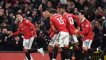 Manchester United's English striker Jadon Sancho (L) celebrates after scoring his team second goal during the English Premier League football match between Manchester United and Leeds United at Old Trafford in Manchester, north west England, on February 8, 2023. - RESTRICTED TO EDITORIAL USE. No use with unauthorized audio, video, data, fixture lists, club/league logos or 'live' services. Online in-match use limited to 120 images. An additional 40 images may be used in extra time. No video emulation. Social media in-match use limited to 120 images. An additional 40 images may be used in extra time. No use in betting publications, games or single club/league/player publications. (Photo by Oli SCARFF / AFP) / RESTRICTED TO EDITORIAL USE. No use with unauthorized audio, video, data, fixture lists, club/league logos or 'live' services. Online in-match use limited to 120 images. An additional 40 images may be used in extra time. No video emulation. Social media in-match use limited to 120 images. An additional 40 images may be used in extra time. No use in betting publications, games or single club/league/player publications. / RESTRICTED TO EDITORIAL USE. No use with unauthorized audio, video, data, fixture lists, club/league logos or 'live' services. Online in-match use limited to 120 images. An additional 40 images may be used in extra time. No video emulation. Social media in-match use limited to 120 images. An additional 40 images may be used in extra time. No use in betting publications, games or single club/league/player publications. (Photo by OLI SCARFF/AFP via Getty Images)