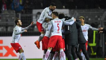 DORTMUND, GERMANY - MARCH 08: Valon Berisha of Red Bull Salzburg (obscured) celebrates with team mates as he scores their first goal from the penalty spot during the UEFA Europa League Round of 16 match between Borussia Dortmund and FC Red Bull Salzburg