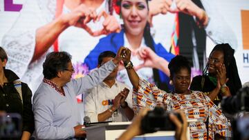 Colombia's presidential candidate Gustavo Petro, accompanied by Francia Marquez, reacts after winning the referendum vote for the Historic Pact coalition, in Bogota, Colombia March 13, 2022. REUTERS/Luisa Gonzalez