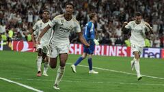 Real Madrid's English midfielder #5 Jude Bellingham celebrates with teammates scoring his team's first goal during the UEFA Champions League 1st round day 1 group C football match between Real Madrid and Union Berlin at the Santiago Bernabeu stadium in Madrid on September 20, 2023. (Photo by Thomas COEX / AFP)