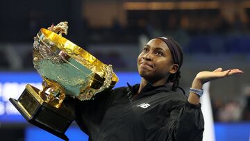Tennis - China Open - China National Tennis Center, Beijing, China - October 6, 2024 Coco Gauff of the U.S. celebrates with the trophy after winning the China Open in the final against Czech Republic's Karolina Muchova REUTERS/Florence Lo