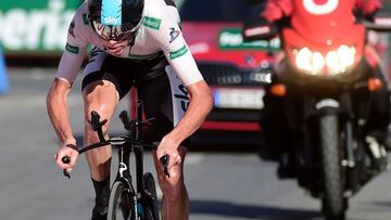 Froome storms to time trail win to slice Quintana’s lead