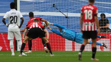 Real Madrid's Belgian goalkeeper Thibaut Courtois dives for the ball during the Spanish league football match between Real Madrid CF and Athletic Club Bilbao at the Santiago Bernabeu stadium in Madrid on June 4, 2023. (Photo by Pierre-Philippe MARCOU / AFP)