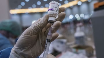 YOGYAKARTA, INDONESIA - JANUARY 13: A health worker prepares a dose of the AstraZeneca COVID-19 booster vaccine during the booster vaccination program on January 13, 2022 in Yogyakarta, Indonesia. While Southeast Asia&#039;s vaccination programs have gath