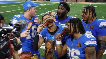 DETROIT, MICHIGAN - NOVEMBER 28: The Detroit Lions celebrate and eat turkey during a CBS interview after beating the Chicago Bears 23-20 at Ford Field on November 28, 2024 in Detroit, Michigan. Gregory Shamus/Getty Images/AFP (Photo by Gregory Shamus / GETTY IMAGES NORTH AMERICA / Getty Images via AFP)