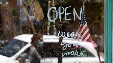 SAN FRANCISCO, CALIFORNIA - JUNE 16: A pedestrian walks by a retail store that has reopened on June 16, 2020 in San Francisco, California. According to a report by the U.S. Commerce Department, retail sales surged 17.7 percent in May as more states begin 