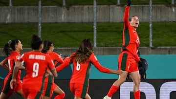 Portugal's forward #23 Telma Encarnacao (R) celebrates with her teammates after scoring her team's first goal during the Australia and New Zealand 2023 FIFA Women's World Cup Group E football match between Portugal and Vietnam at Waikato Stadium in Hamilton on July 27, 2023. (Photo by Saeed KHAN / AFP)