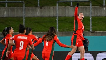Portugal's forward #23 Telma Encarnacao (R) celebrates with her teammates after scoring her team's first goal during the Australia and New Zealand 2023 FIFA Women's World Cup Group E football match between Portugal and Vietnam at Waikato Stadium in Hamilton on July 27, 2023. (Photo by Saeed KHAN / AFP)