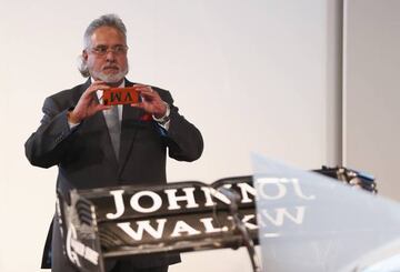 Vijay Mallya, Team Principal and Managing Director takes a photo of the VJM10 car during the Sahara Force India Formula One team launch at Silverstone.