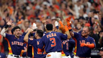 HOUSTON, TEXAS - NOVEMBER 05: Jeremy Pena #3 and Christian Vazquez #9 of the Houston Astros celebrate after Yordan Alvarez #44 of the Houston Astros hit a three-run home run against the Philadelphia Phillies during the sixth inning in Game Six of the 2022 World Series at Minute Maid Park on November 05, 2022 in Houston, Texas.   Carmen Mandato/Getty Images/AFP