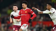 MANCHESTER, ENGLAND - JANUARY 10: Ezri Konsa of Aston Villa and Jesse Lingard of Manchester United compete for the ball during the Emirates FA Cup Third Round match between Manchester United and Aston Villa at Old Trafford on January 10, 2022 in Mancheste