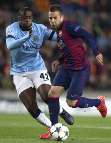 Jordi Alba y Yaya Touré.