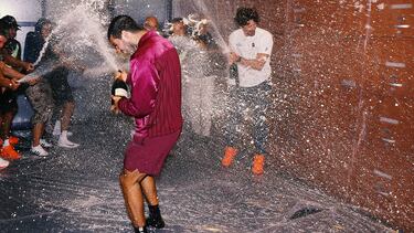 NEW YORK, NEW YORK - SEPTEMBER 07: Carlos Alcaraz of Spain celebrates with his trophy being sprayed with champagne by his team in the locker room after defeating Jannik Sinner of Italy during their Men's Singles Final match on Day Fifteen of the 2025 US Open at USTA Billie Jean King National Tennis Center on September 07, 2025 in New York City. Clive Brunskill/Getty Images/AFP (Photo by CLIVE BRUNSKILL / GETTY IMAGES NORTH AMERICA / Getty Images via AFP)