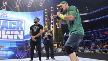 Paul Heyman, Roman Reigns y John Cena en SmackDown.