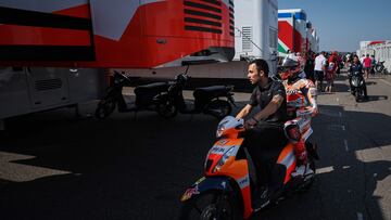 Repsol Honda Team's Spanish rider Marc Marquez is escorted back to the paddock after a crash during the Warm-Up prior to the MotoGP German motorcycle Grand Prix at the Sachsenring racing circuit in Hohenstein-Ernstthal near Chemnitz, eastern Germany, on June 18, 2023. (Photo by Ronny Hartmann / AFP)