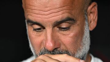 (FILES) Manchester City's Spanish head coach Pep Guardiola gestures ahead of the FIFA Club World Cup 2025 round of 16 football match between England's Manchester City and Saudi's Al-Hilal at the Camping World stadium in Orlando on June 30, 2025. Manchester City, which has amassed championships, domestic cups and even a Champions League title over the last decade, ended last season without any trophies. As Pep Guardiola enters his tenth season, can he lead the club back to success? (Photo by PATRICIA DE MELO MOREIRA / AFP)