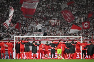 Freiburg's players celebrate with fans after the UEFA Europa League Group G football match 