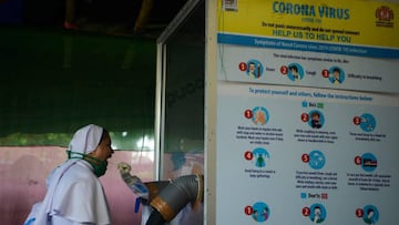 A health official collects nasal and throat swab samples from a nun to test for the Covid-19 coronavirus at a primary health centre in Siliguri on September 2, 2020. - India on August 30 set a coronavirus record when it reported 78,761 new infections in