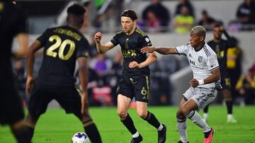 July 8, 2023; Los Angeles, California, USA; Los Angeles FC midfielder Ilie Sanchez (6) moves the ball against San Jose Earthquakes midfielder Carlos Gruezo (7)during the second half at BMO Stadium. Mandatory Credit: Gary A. Vasquez-USA TODAY Sports