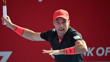 Spain�s Roberto Bautista Agut hits a return to Argentina�s Francisco Cerundolo during their men's singles tennis match at the Hong Kong Open in Hong Kong on January 4, 2024. (Photo by Peter PARKS / AFP)