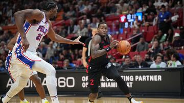 Apr 4, 2024; Miami, Florida, USA; Miami Heat guard Terry Rozier (2) drives to the basket as Philadelphia 76ers center Joel Embiid (21) defends during the first half at Kaseya Center. Mandatory Credit: Jim Rassol-USA TODAY Sports