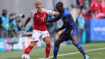 COPENHAGEN, DENMARK - JUNE 12: Daniel Wass of Denmark battles for possession with Glen Kamara of Finland during the UEFA Euro 2020 Championship Group B match between Denmark and Finland on June 12, 2021 in Copenhagen, Denmark. (Photo by Friedemann Vogel -