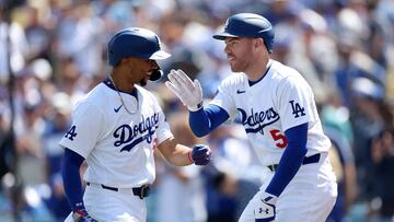 LOS ANGELES, CALIFORNIA - MARCH 28: Freddie Freeman #5 congratulates Mookie Betts #50 of the Los Angeles Dodgers after his solo homerun during the third inning of a game against the St. Louis Cardinals at Dodger Stadium on March 28, 2024 in Los Angeles, California.   Sean M. Haffey/Getty Images/AFP (Photo by Sean M. Haffey / GETTY IMAGES NORTH AMERICA / Getty Images via AFP)