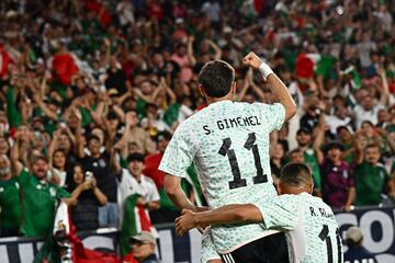 Fans cheer as Mexico's forward Santiago Giménez celebrates his goal against Haiti.