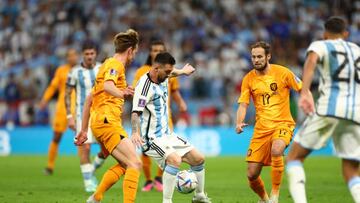 LUSAIL CITY, QATAR - DECEMBER 09: Lionel Messi of Argentina and Daley Blind of Netherlands in action during the FIFA World Cup Qatar 2022 quarter final match between Netherlands and Argentina at Lusail Stadium on December 09, 2022 in Lusail City, Qatar. (Photo by Amin Mohammad Jamali/Getty Images)