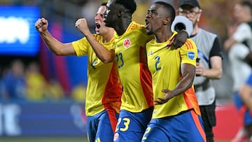 Colombia's defender #04 Santiago Arias, Colombia's defender #23 Davinson Sanchez and Colombia's defender #02 Carlos Cuesta celebrate their team's victory in the Conmebol 2024 Copa America tournament semi-final football match between Uruguay and Colombia at Bank of America Stadium, in Charlotte, North Caroline on July 10, 2024. (Photo by Chandan Khanna / AFP)