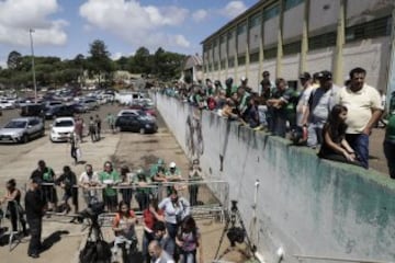 Fans of Brazil's soccer team Chapecoense gather outside the Arena Conda stadium in Chapeco, Brazil, Tuesday, Nov. 29, 2016. A chartered plane that was carrying the Brazilian soccer team to the biggest match of its history crashed into a Colombian hillside and broke into pieces, killing 75 people and leaving six survivors, Colombian officials said Tuesday. (AP Photo/Andre Penner)