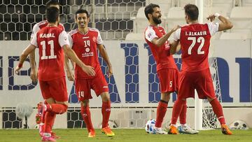 Persepolis&#039; players celebrate their second goal during the AFC Champions League quarter-finals match between Iran&#039;s Persepolis and Uzbekistan&#039;s Pakhtakor on September 30, 2020, at the Jassim Bin Hamad Stadium in the Qatari capital Doha. (Ph