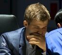 Carlsen y Anand firman tablas en una corta novena partida