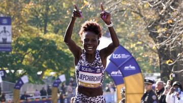 Women&#039;s division winner Peres Jepchirchir of Kenya crosses the finish line during the 2021 TCS New York City Marathon in New York on November 7, 2021. - After a forced break in 2020, the New York City Marathon is back on for its 50th edition, and with it the countless opportunities to run it for charity, an industry that has become a staple, and hopes to take off again after the pandemic. (Photo by TIMOTHY A. CLARY / AFP)